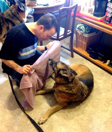 Rob dries Mia off after her adventure in the woods.